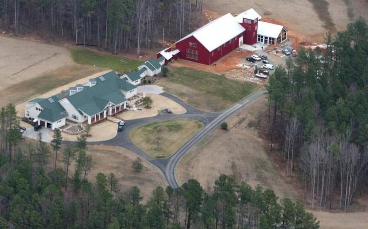 The home of John Edwards in Chapel Hill, seen in January 2007. The buildings include a gymnasium, a pool, a raquetball court and a 10,778 square foot main home.