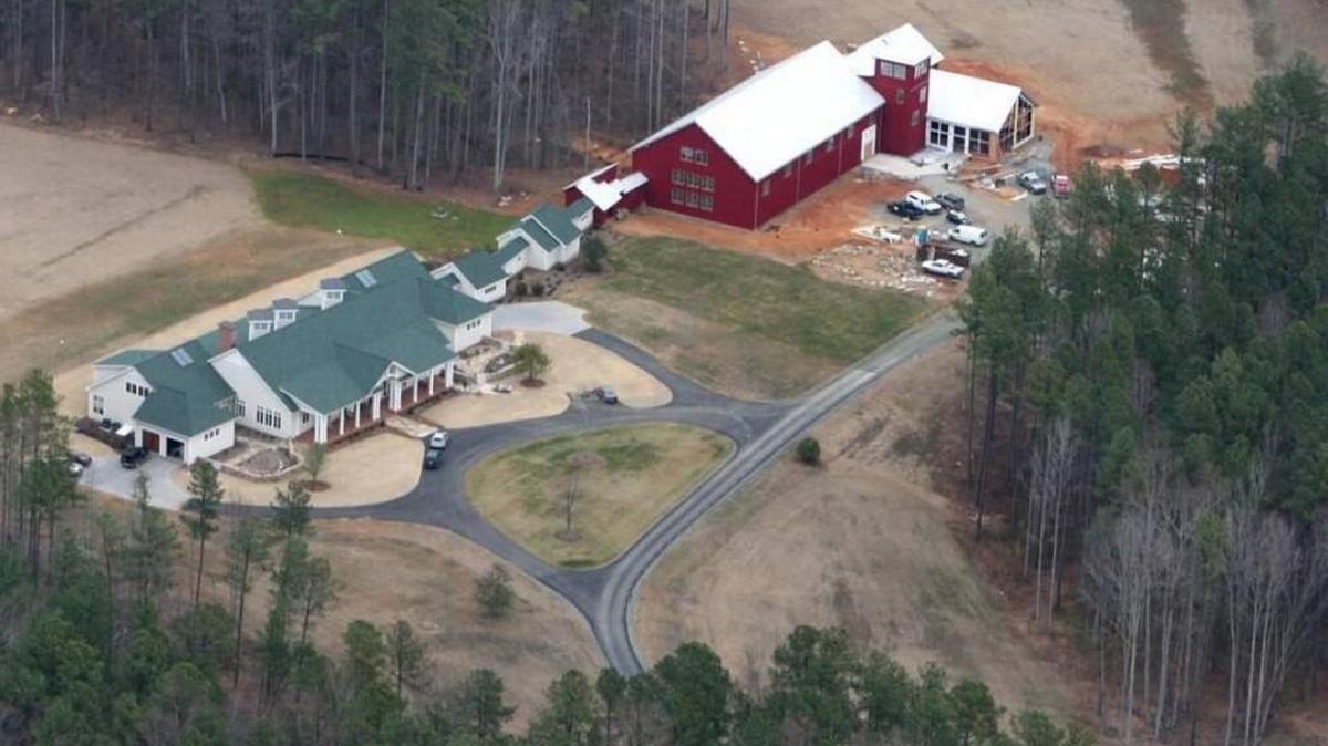 The home of John Edwards in Chapel Hill, seen in January 2007. The buildings include a gymnasium, a pool, a raquetball court and a 10,778 square foot main home.