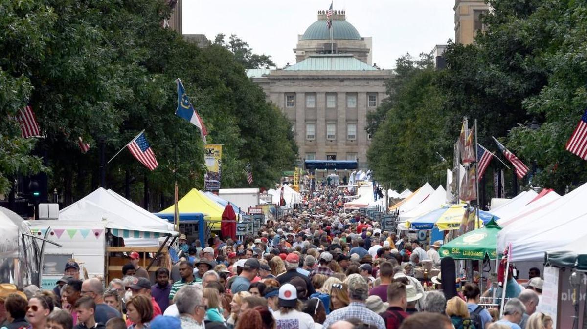 The crowd fills Fayetteville Street looking north toward the State Capitol in downtown Raleigh during Wide Open Bluegrass in 2017. The U.S. Census Bureau estimates that North Carolina’s population has aged by 2 years over the last decade.