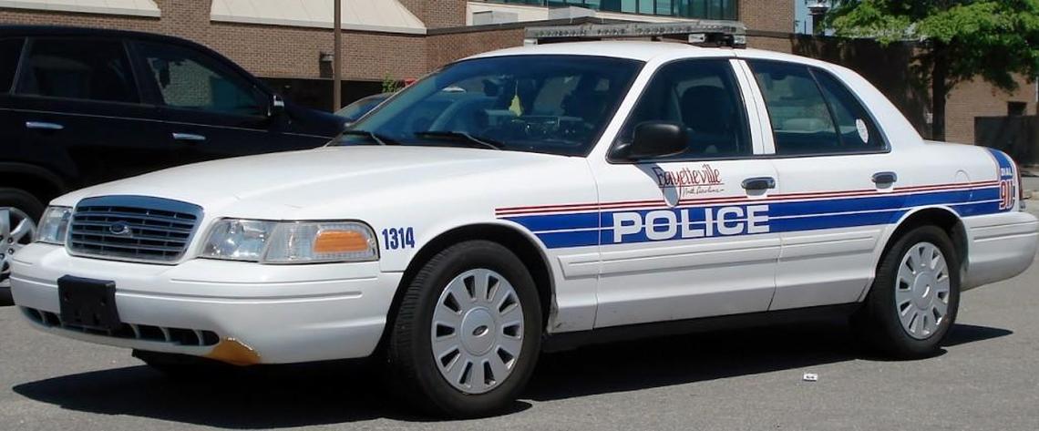 A photo of a 2007 model Ford Crown Victoria police interceptor from the Fayetteville Police Department.