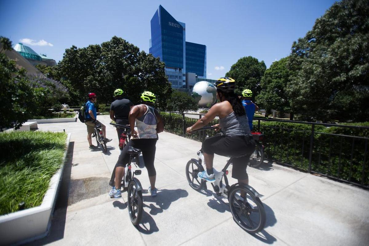 Todd Masinter, of Triangle Glides, leads a group of electric bicyclists on an 8.7 mile tour of downtown Raleigh.