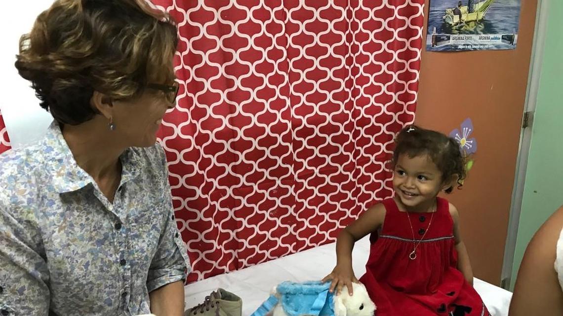 MiracleFeet founder and executive director Chesca Colloredo-Mansfeld talks to a patient named Lucia after a successful brace check-up at the clubfoot clinic at La Mascota Hospital in Managua, Nicaragua.