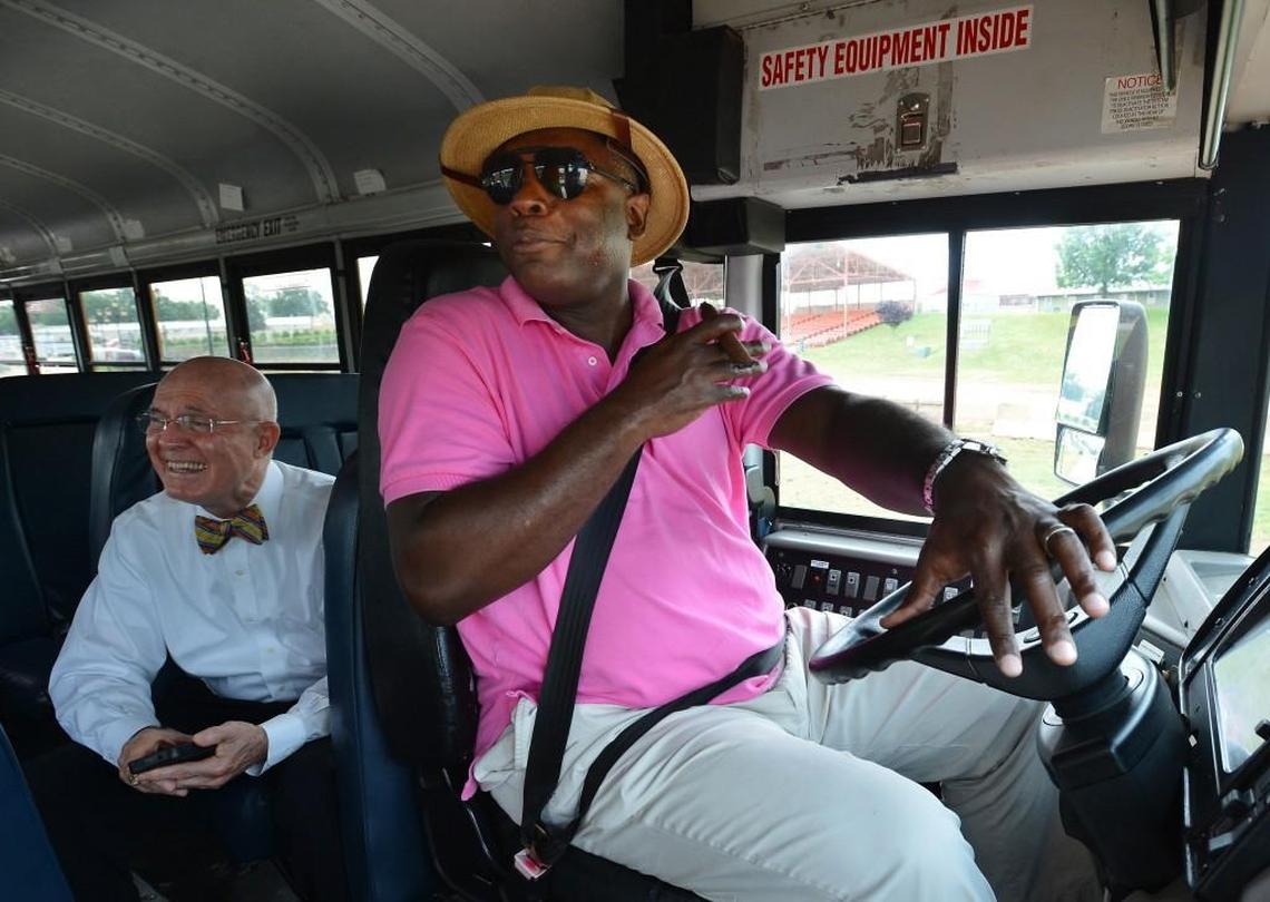 Ben Matthews, Director of School Support for the N.C. Department of Public Instruction laughs as News & Observer columnist Barry Saunders takes part in the annual State School Bus ROADeo. The annual event, held at the North Carolina fairgrounds in May 2013, featured 48 drivers. They participated in events that graded the drivers on nine different “obstacles” including parallel parking, railroad crossing protocol and negotiating tight fitting barriers. Saunders broke so many rules they stopped counting during his turn at the wheel.