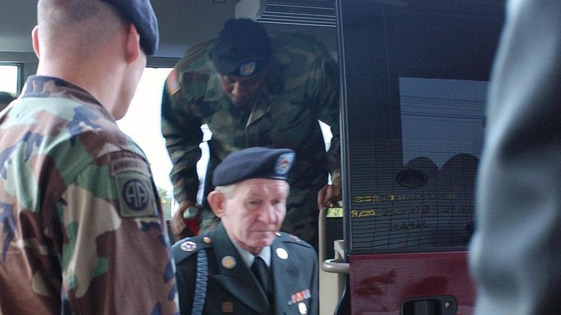 Sgt. Charles R. Jenkins, center, steps off a mini-bus before his first court-marshal hearing at Camp Zama U.S. army base, west of Tokyo, Japan, on Nov 3, 2004. Jenkins was court-martialed and served 25 days in a U.S. military jail in Japan.
