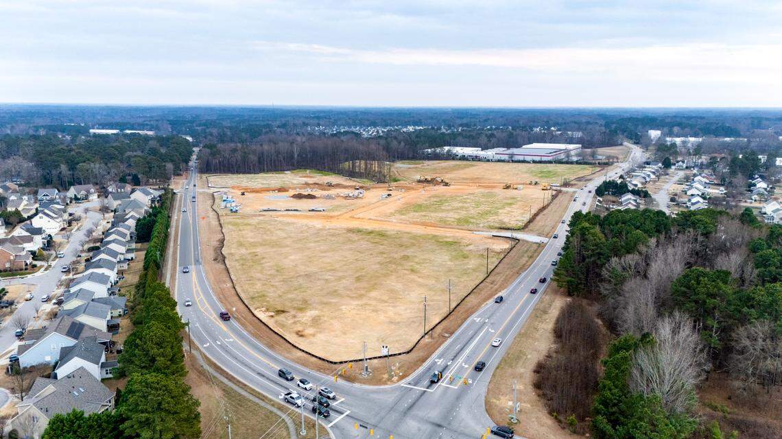 A Triangle development still under construction has signed on four new tenants, including a restaurant.