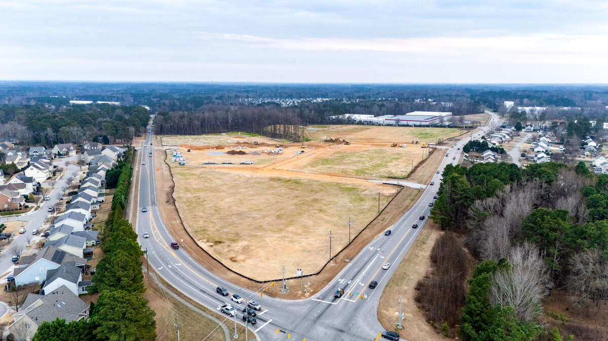 A Triangle development still under construction has signed on four new tenants, including a restaurant.