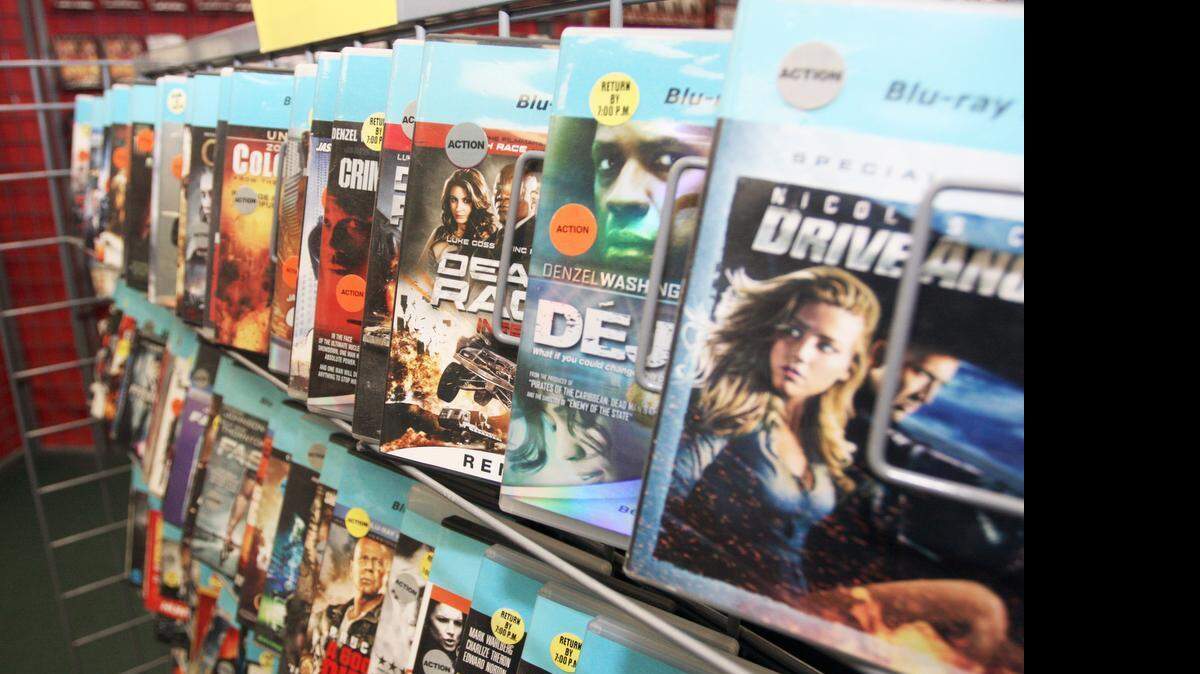 
Videos sit on shelves at North American Video in West Raleigh in July 2014. The store is closing this summer.
