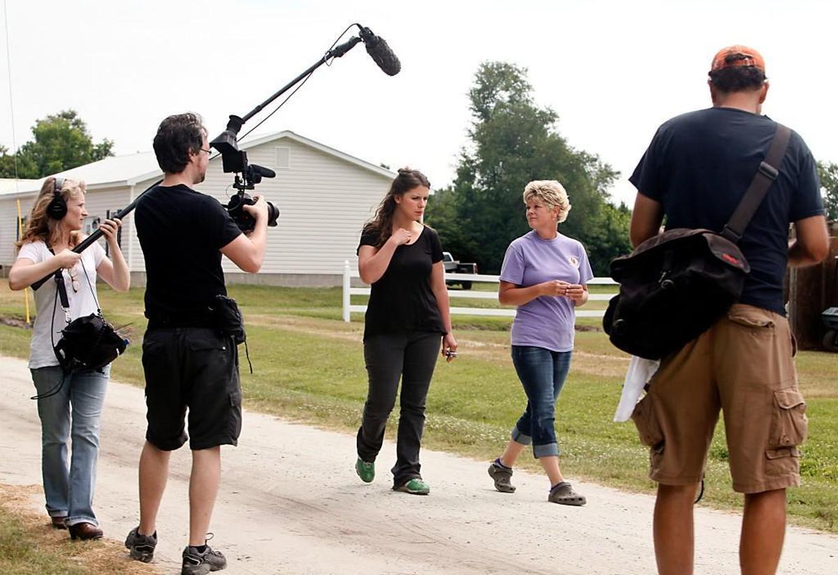 Chef Vivian Howard, center left, interviews farmer Christy Crumpler, of Brittany Ridge Farms, center right, while filming her PBS show “A Chef’s Life” on location in Hookerton, N.C. in 2014. The PBS series “A Chef’s Life,” began in 2013 and focuses on bringing the ingredients of Southern cooking and the traditions of eastern North Carolina to a national audience.