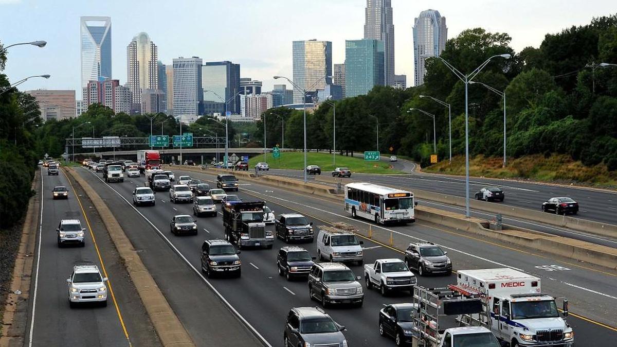Commuters leave Charlotte on US 74. Propelled largely by growth in its two largest urban centers, North Carolina’s population passed the 10 million mark in the past year.