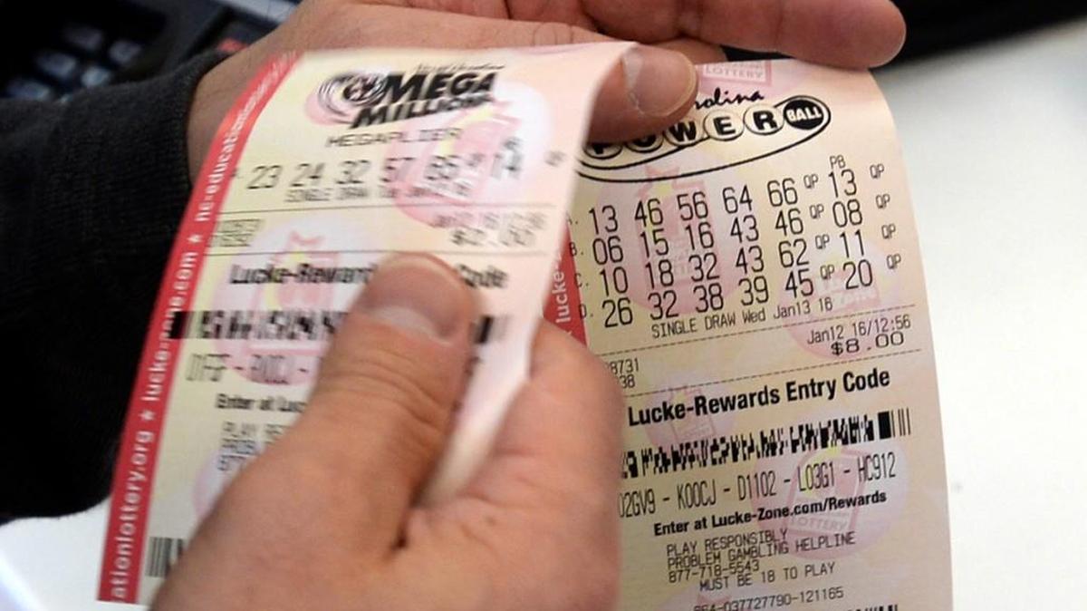 A customer shows off his lottery tickets in Charlotte in 2016.