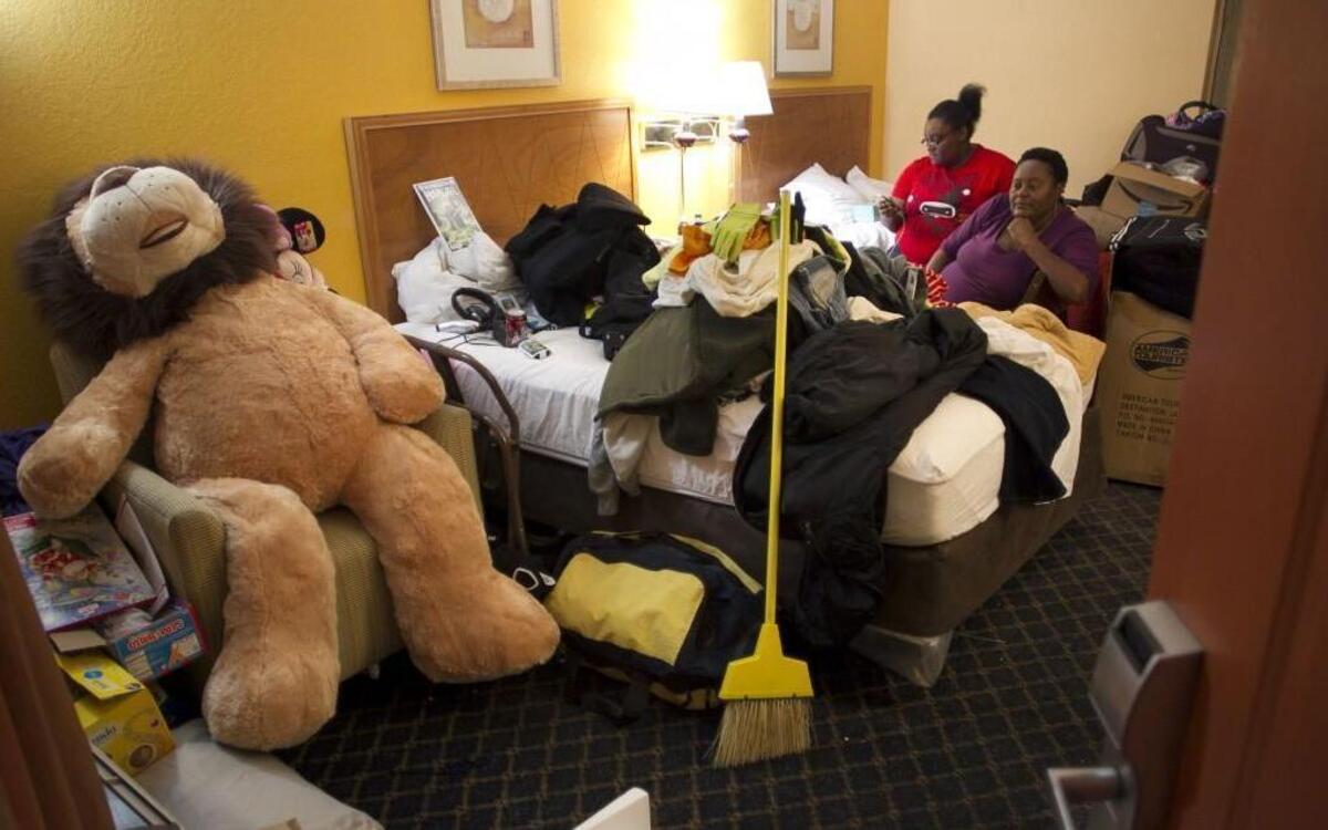 Minnie White, her daughter Marisia White, age 22, in their room at the Econolodge on Thursday, Jan. 12, 2017 in Battleboro, N.C. They were displaced from their Princeville home following Hurricane Matthew in October, 2016. They have lived here for three months while they search for another home they can afford. White also has her fifteen-year-old dog Spirit living in the room with her family. The large lion was a recent birthday present for Marisia.