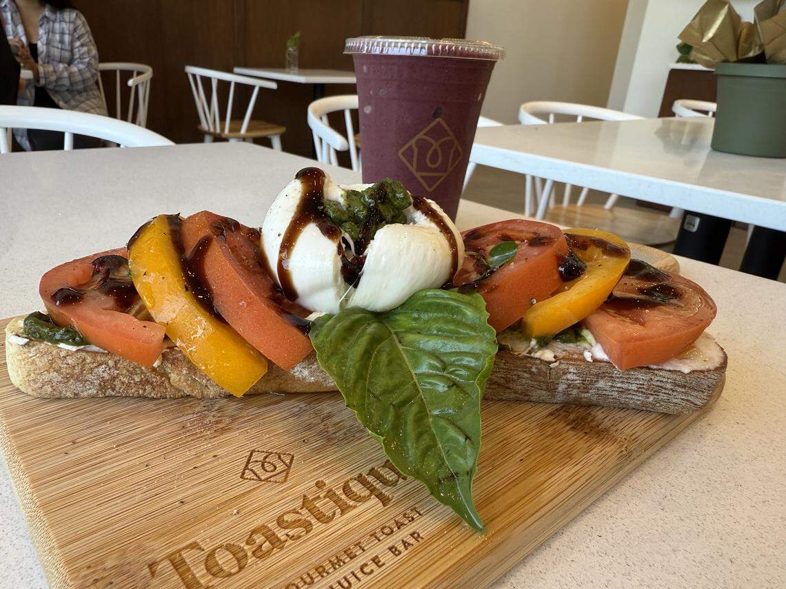 The Tomato Burrata toast and Superfruit smoothie are among several signature toasts and blended beverages available at Toastique.