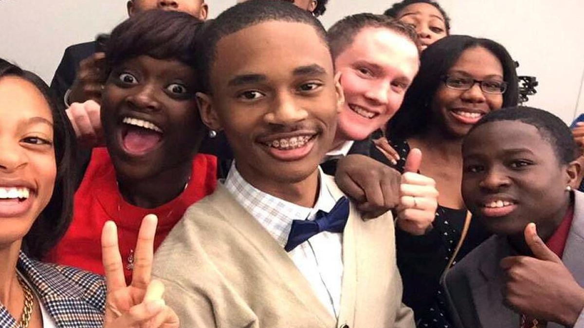 Chris Suggs, 16, center, created a nonprofit called Kinston Teens that would give him and his peers a chance to improve their community through service projects, as well as have a voice in local affairs. Suggs and his group have won accolades both locally and nationally. In April, Suggs became the youngest person to receive a community leadership award from the Federal Bureau of Investigation. He received the award on a trip to Washington D.C., where he met then-FBI director James Comey.