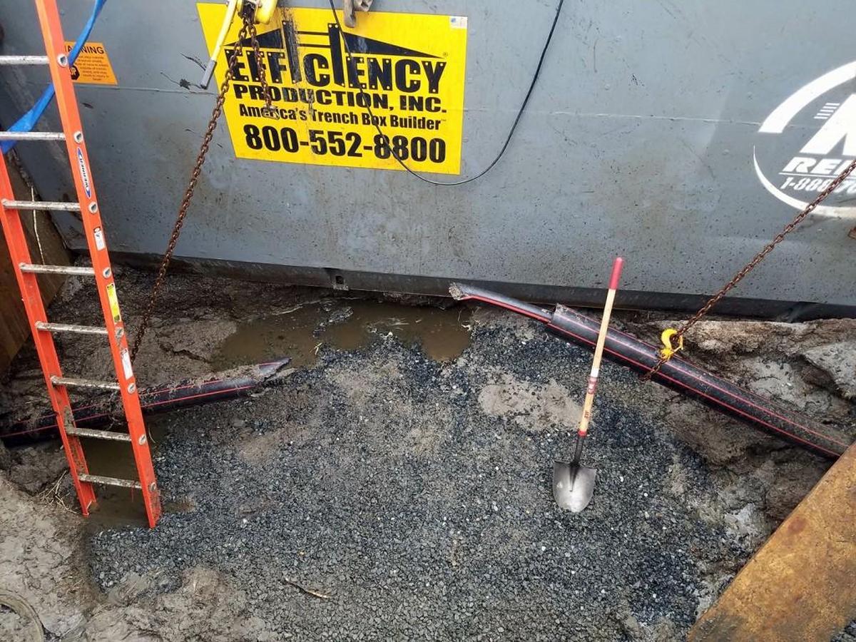 Crews have exposed one of the power cables, revealing that it was severed by the steel casing.