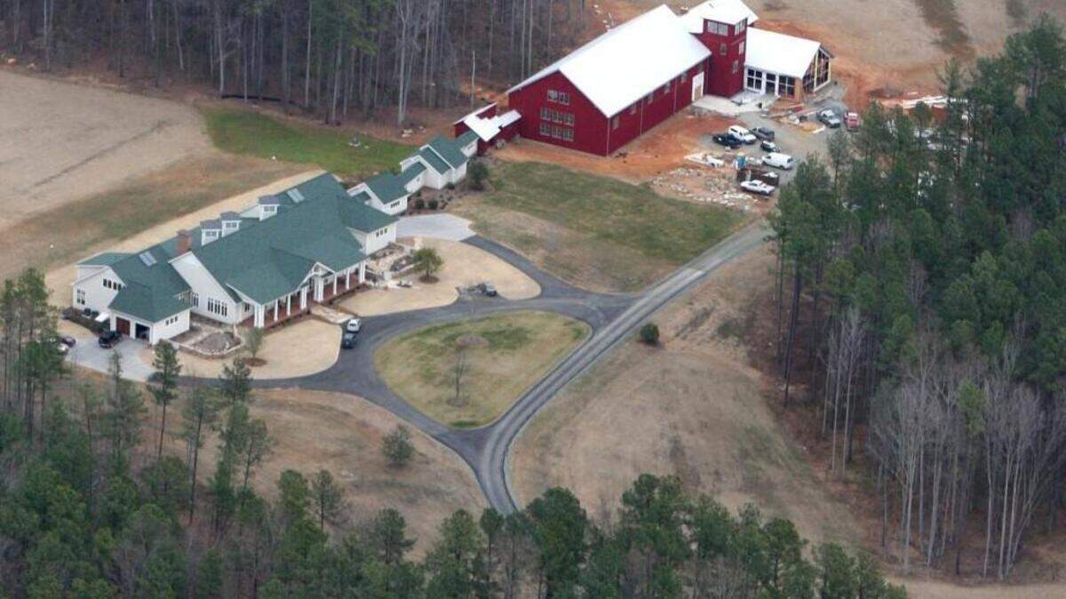 The home of John Edwards in Chapel Hill, seen in January 2007. The buildings include a gymnasium, a pool, a raquetball court and a 10,778 square foot main home.