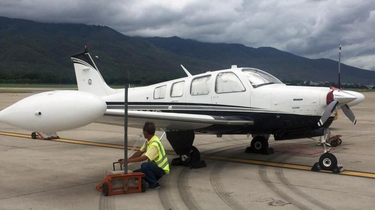 A worker ties down Adam Broome’s plane, call sign 31 Romeo, at Chiang Mai, Thailand, on June 10, 2016. Broome recently flew around the world in this single-engine Beechcraft Bonanza A36 aircraft.
