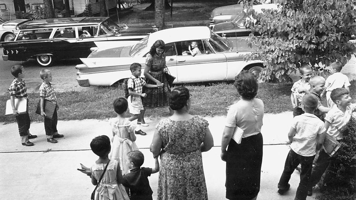 June Campbell walks with her son, William Campbell, to school in 1960. William Campbell was the first black student to integrate Raleigh schools. He later became mayor of Atlanta.