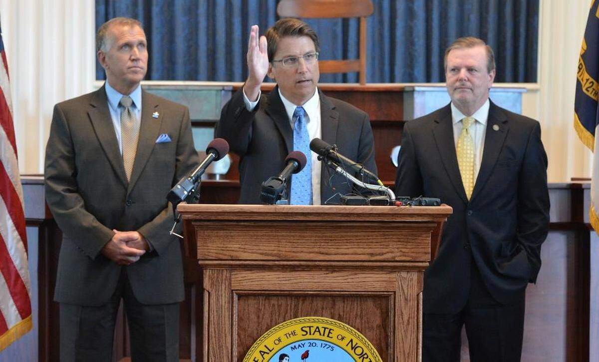 Former Gov. Pat McCrory, center, and Senate leader Phil Berger, right, were targets on the ‘HotRodEarl’ Twitter account.