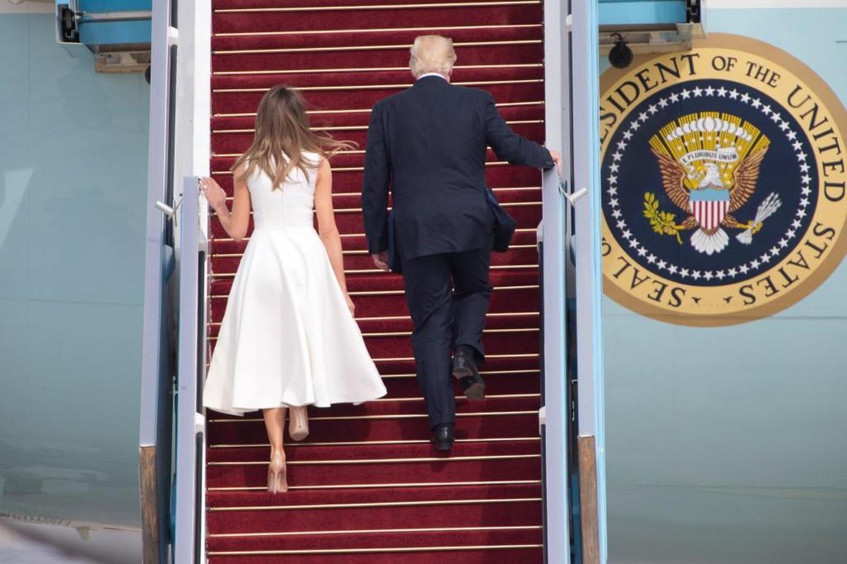 President Donald Trump and his wife, Melania, climb the stairs to Air Force One – without holding hands – as they leave from Ben Gurion airport near Tel Aviv, Israel on Tuesday.