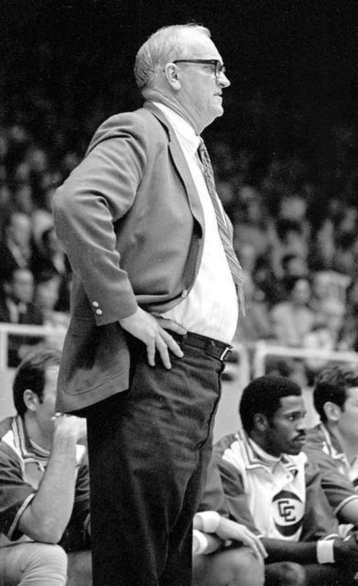 Bones McKinney, shown coaching the Carolina Cougars, looks at the action in the Old Charlotte Coliseum.