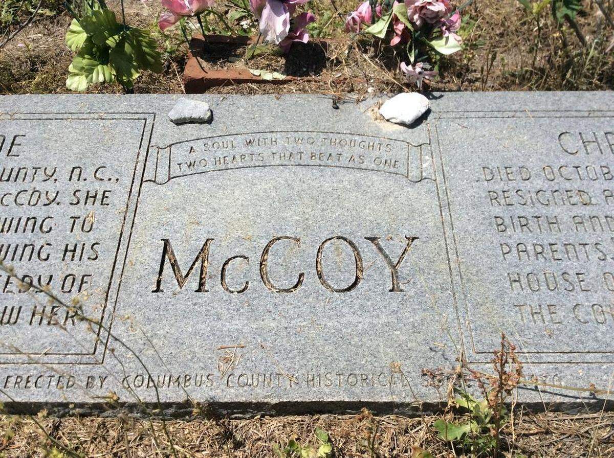 The grave of Millie-Christine McCoy sits hidden off a remote rural road in Columbus County, not far from Whiteville. Visitors still leave flowers. The conjoined twins lived and died nearby.