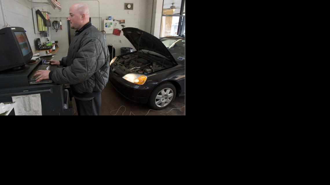 
Tony Jones conducts an auto inspection at Peace Street Inspection Center in Raleigh. 
