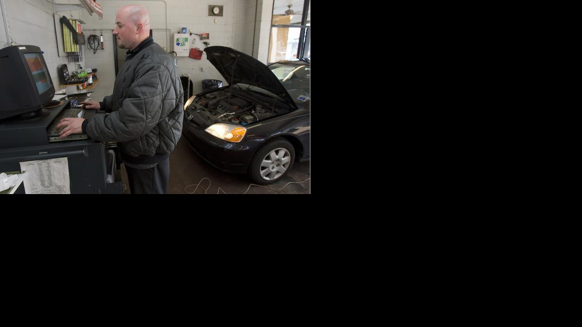 
Tony Jones conducts an auto inspection at Peace Street Inspection Center in Raleigh. 
