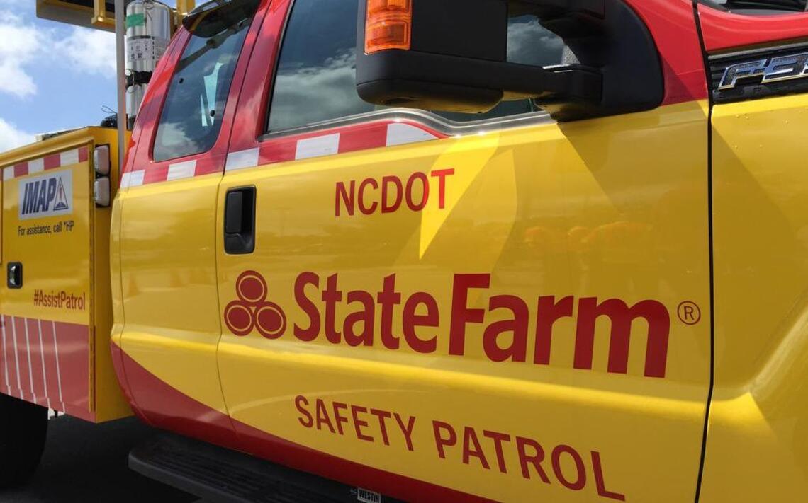 Road Worrier: NCDOT puts insurance logos on yellow IMAP trucks