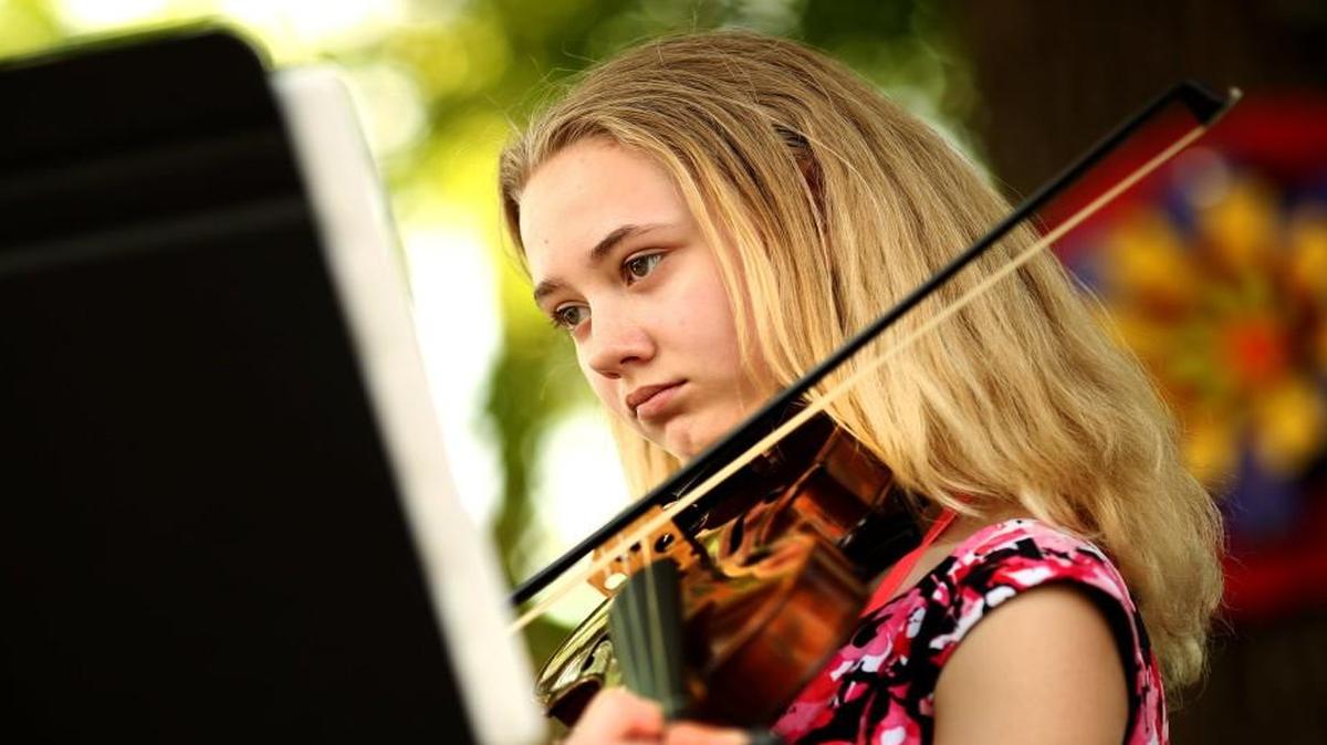Emma Palys, 12, performs during the Clayton Spring Art Walk in downtown Clayton, N.C. on Saturday, April 29, 2017.