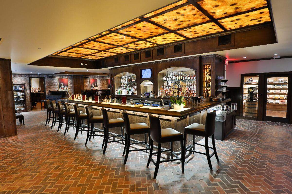 Durham’s Red Phone Booth will offer guests hundreds of spirits, craft cocktails and a walk-in cigar humidor.