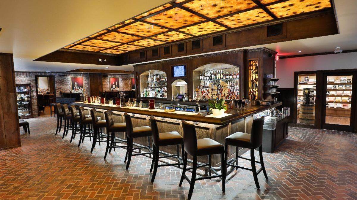 Durham’s Red Phone Booth will offer guests hundreds of spirits, craft cocktails and a walk-in cigar humidor.