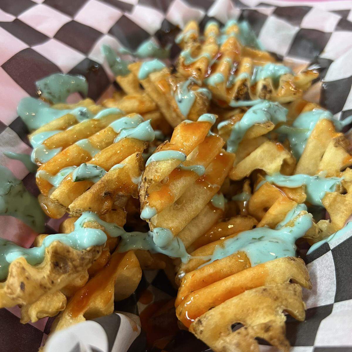 The Dirty V offers several kinds of waffle fries, available plain or topped with sauces, cheese, onions and other ingredients.