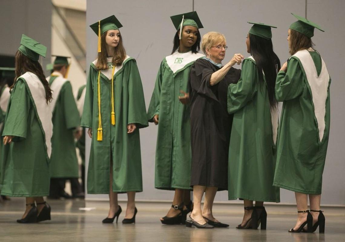 English teacher Joann Duncan adjusts the caps and gowns of Cary High School graduates as they pass her inspection backstage at the Raleigh Convention Center before walking across the stage to receive their diplomas on June 12, 2017 in Raleigh, N.C. Duncan has taught for 53 years, and has coordinated graduation at Cary High School for twenty years. “She is a Cary treasure and one of our most spirited teachers,” said Amanda Boshoff, assistant principal. How Robert Willett got the shot: I positioned myself behind the stage as graduates lined up to receive their diplomas. I noticed the attention Duncan was giving each student that passed her. I used a low camera angle and a long lens to isolate them. I used a Canon-1DX camera with a 70-200mm lens, the ISO was set at 2500, and the exposure was 1/125 second at f/3.2.