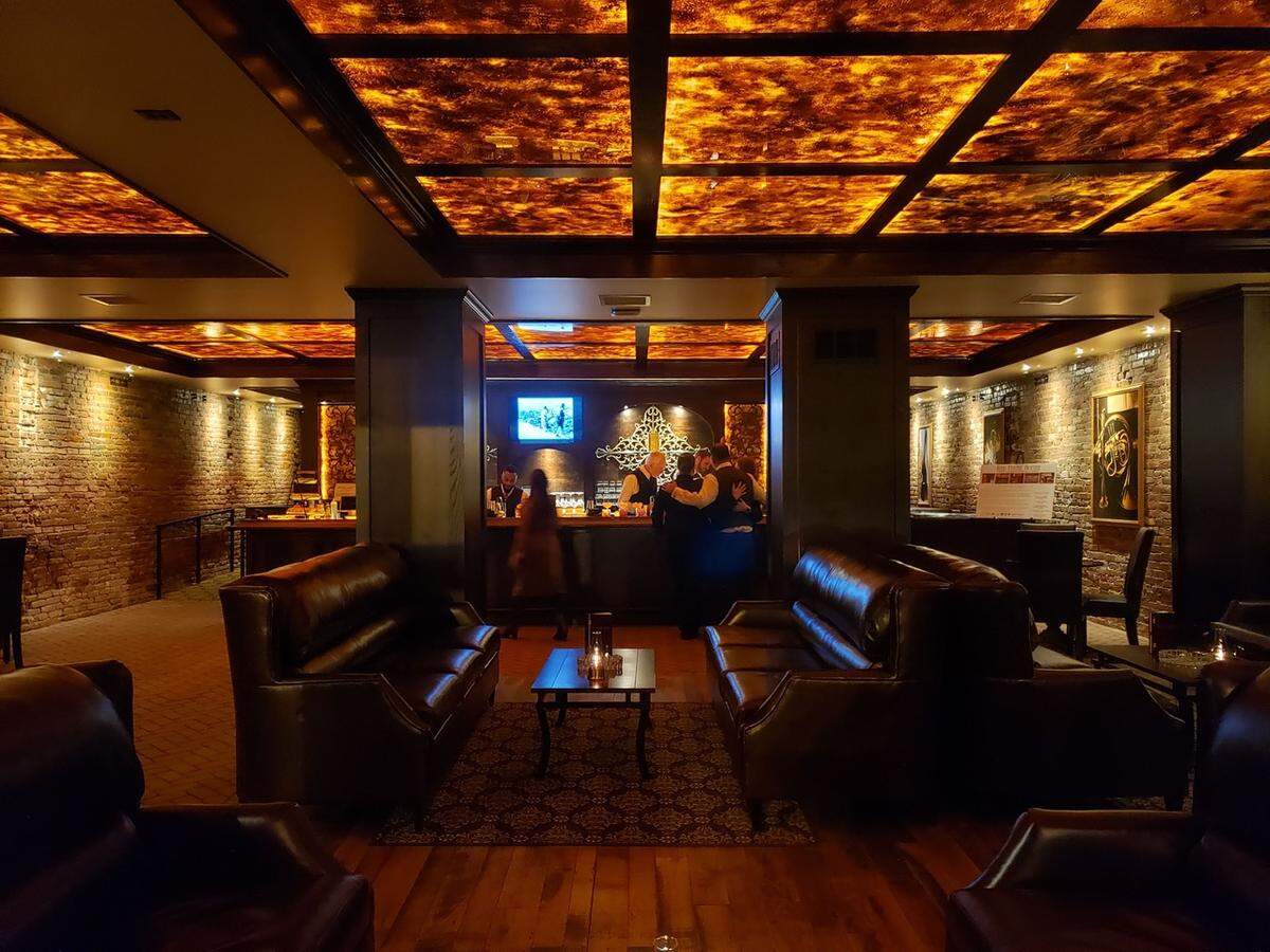 Inside Red Phone Booth, guests should expect vintage decor, hand-painted ceilings and fine art.