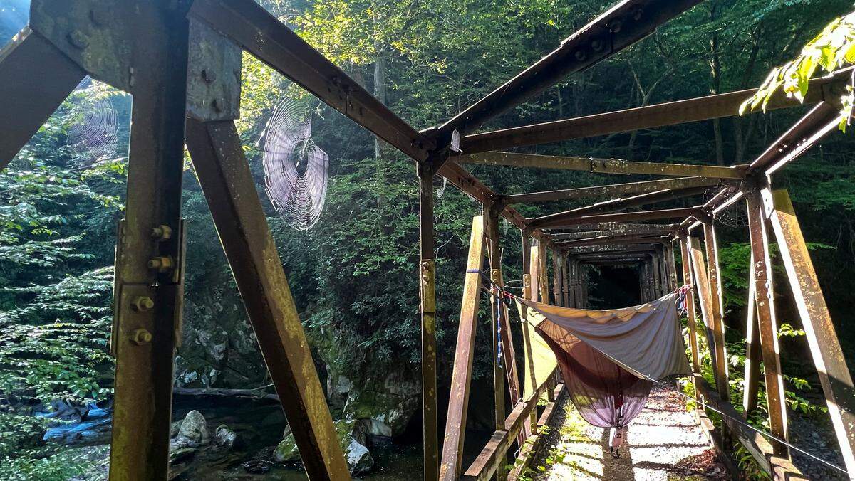 Back Country Camp 47 in the Great Smoky Mountains National Park features a challenging 3.2-mile hike rewarded with a rustic pedestrian bridge over Raven Fork and a primitive riverside campsite.
