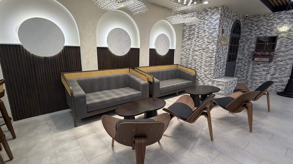 The interior of the new Paris Banh Mi in Chapel Hill features custom furniture and bright lighting.