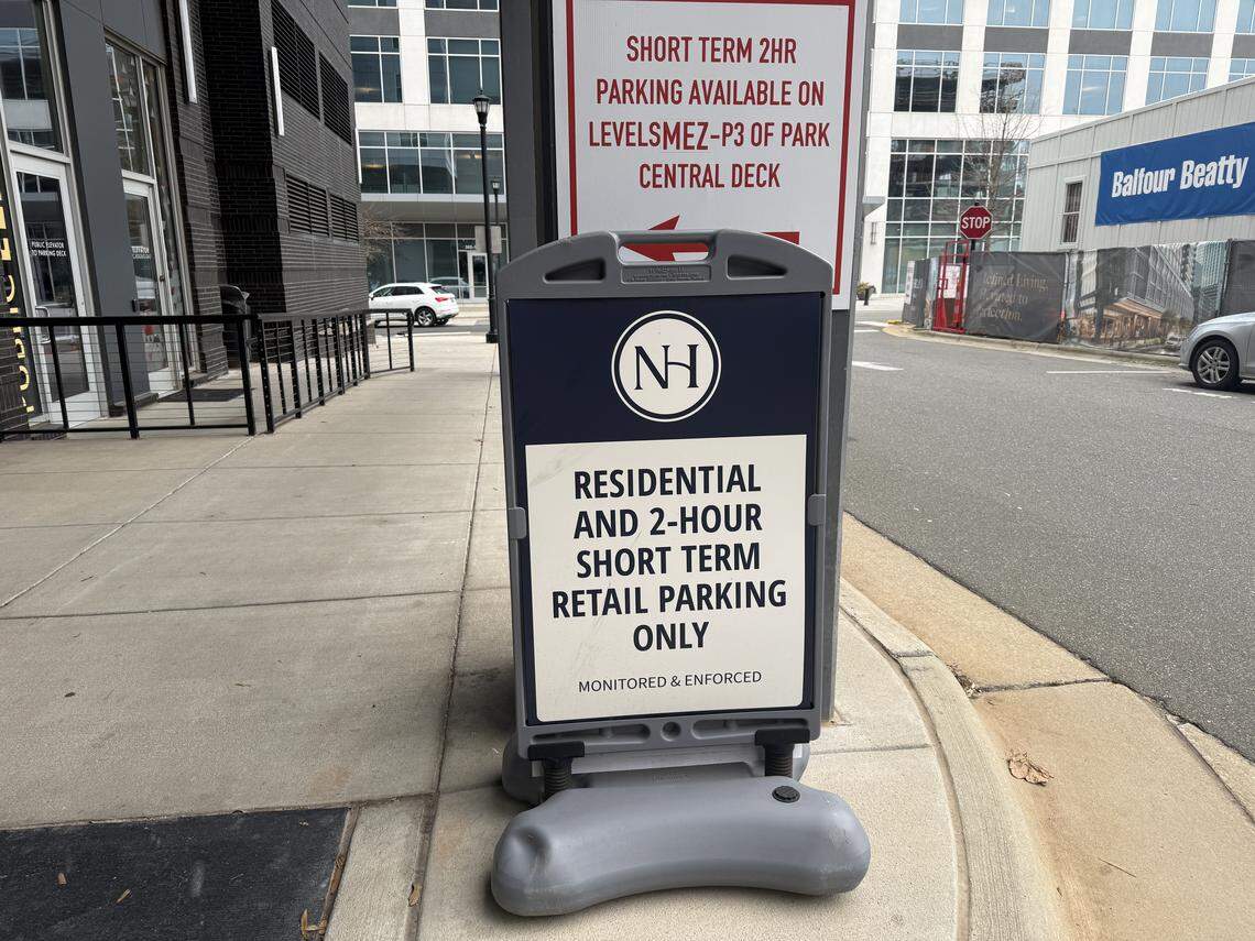 A sign outside the Park Central deck at North Hills points visitors to complimentary two-hour parking.