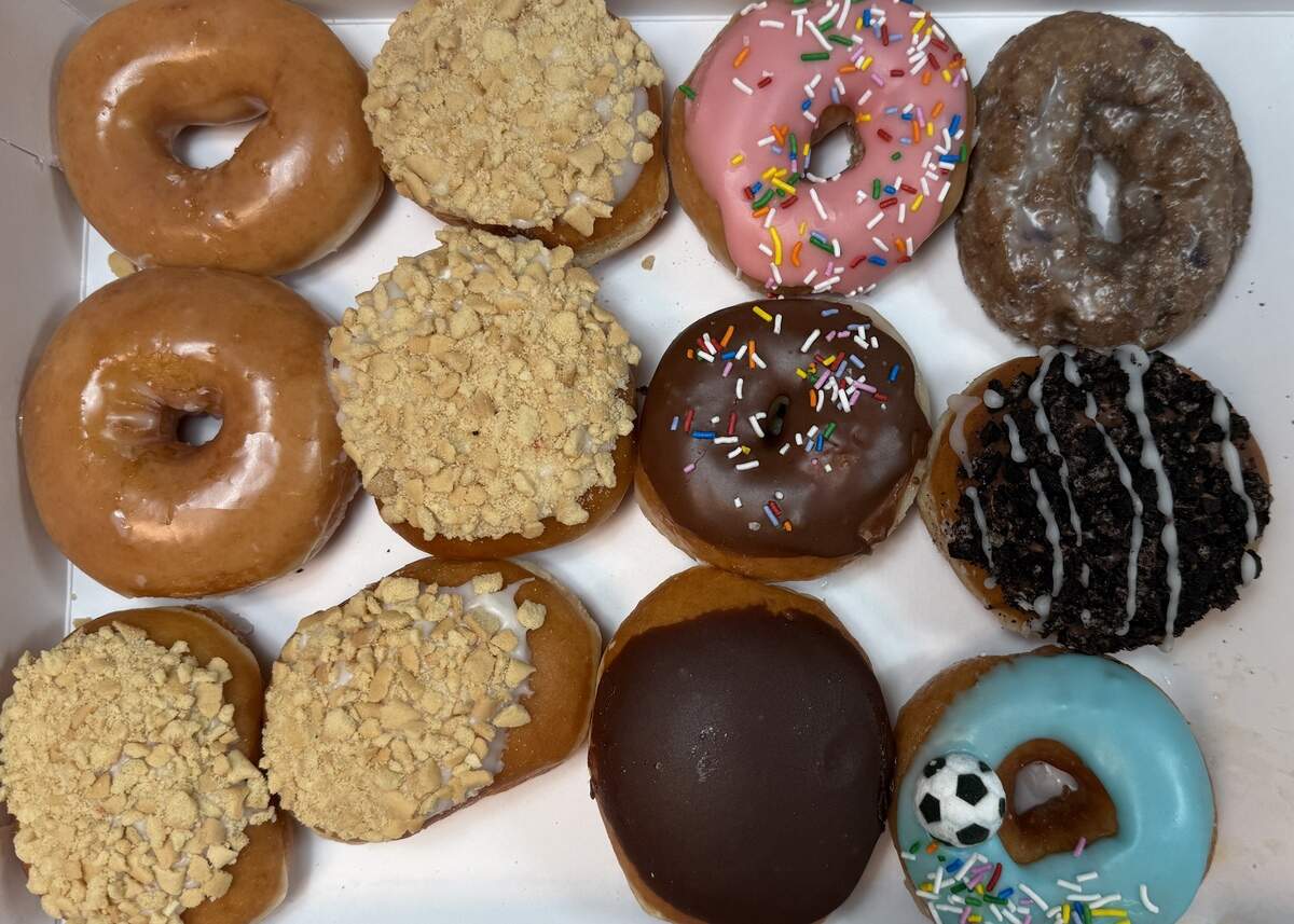 A Too Good To Go “surprise bag” from Krispy Kreme was filled with an assorted variety of a dozen doughnuts.
