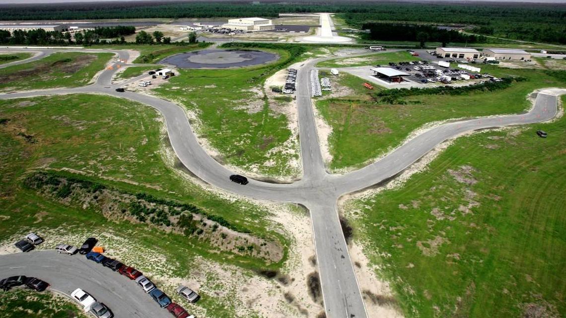 Vehicles navigate a driving course at Blackwater Worldwide’s campus in Moyock, N.C., Monday, July 21, 2008. Blackwater is a campus with a deep pride in the armed forces for which many employees _ and most executives _ served, and it’s also a culture obsessed with identifying and improving inefficiencies in military operations and training. (AP Photo/Gerry Broome)
