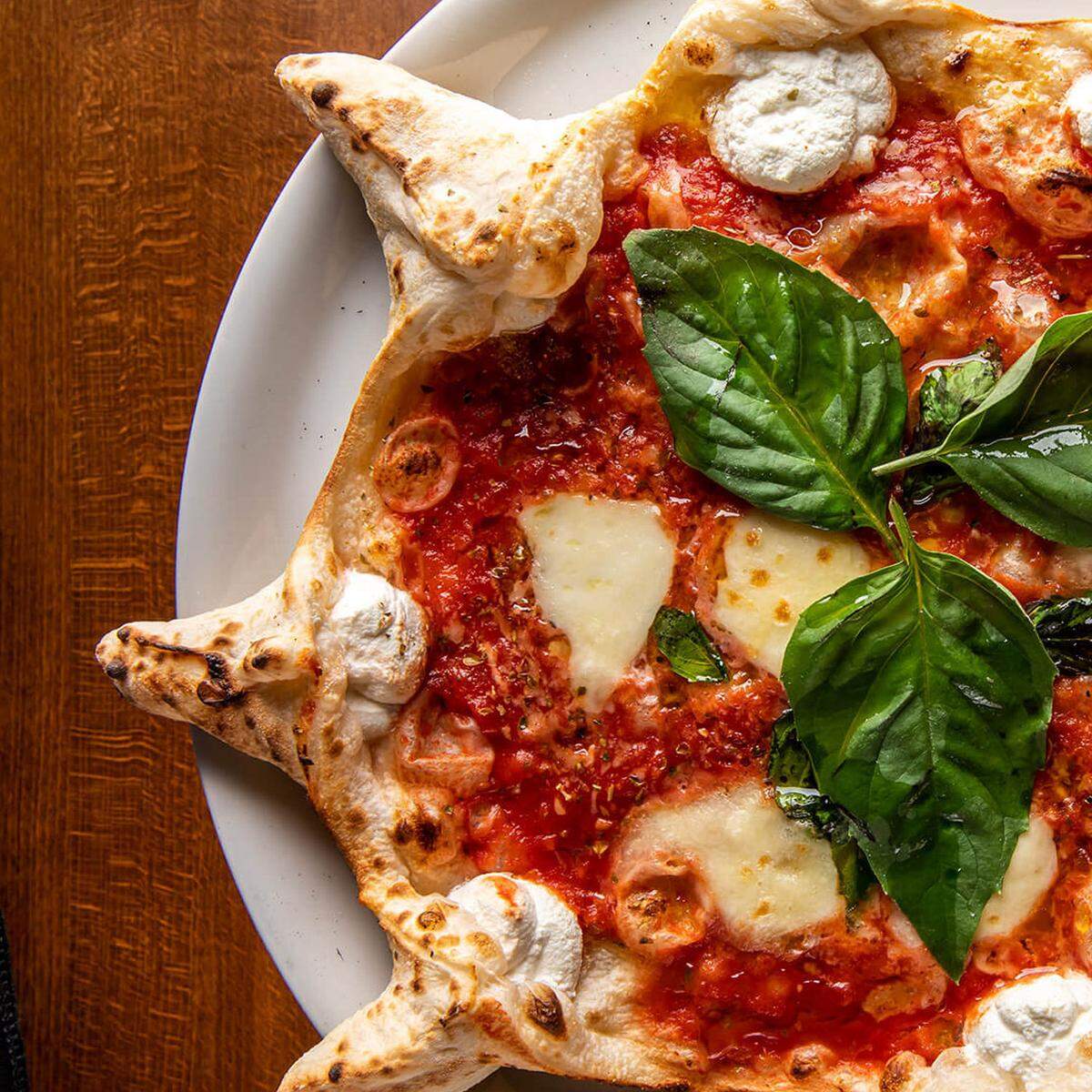 Neapolitan-style pizza and other Italian-inspired dishes are on the menu at Red Phone Booth.