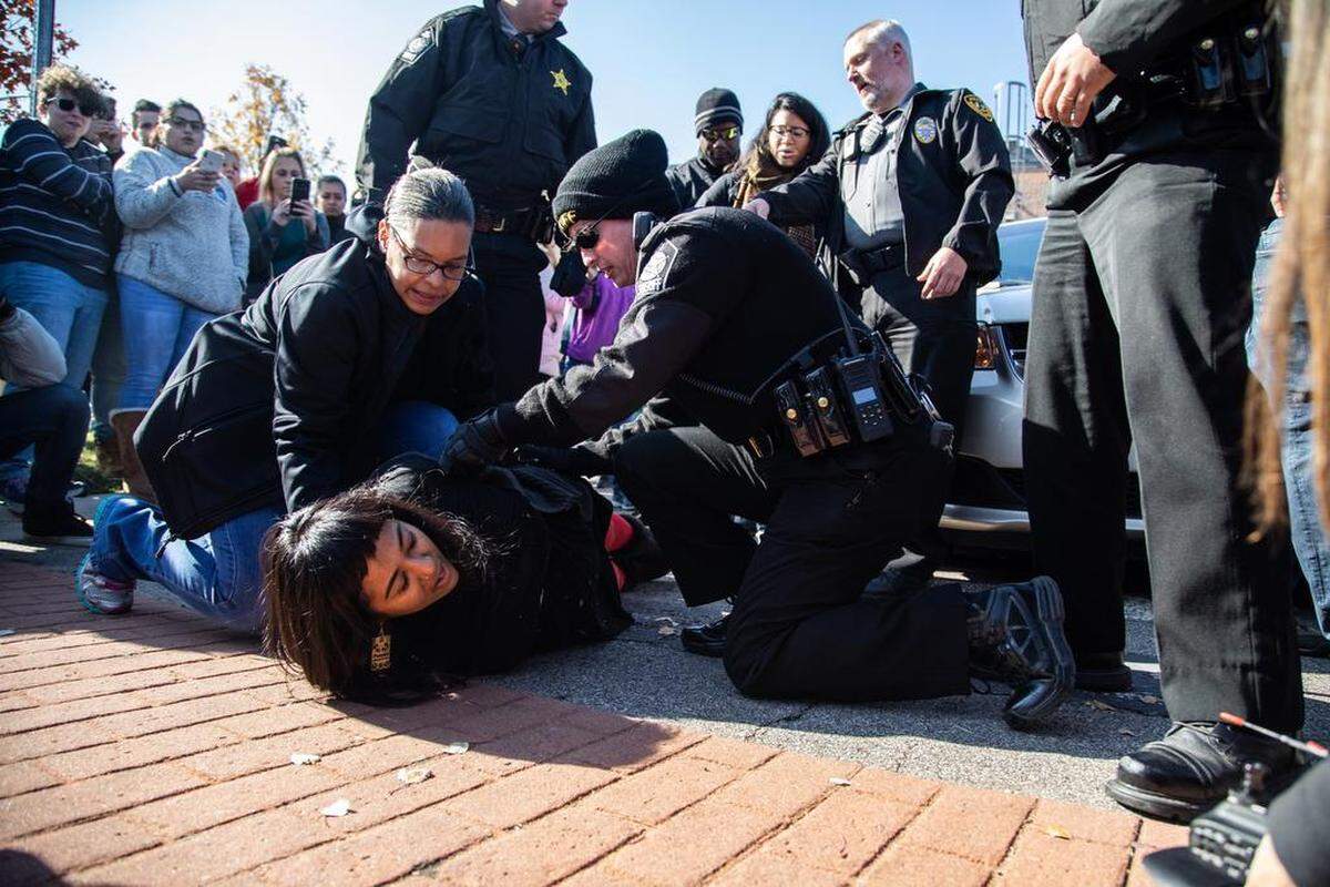 A demonstrator is arrested after Samuel Oliver-Bruno, 47, an undocumented man was arrested Friday by immigration officers in Morrisville after he left the CityWell United Methodist Church of Durham where he has been living for 11 months. Churches are one of the few places where U.S. Immigration and Customs Enforcement do not make arrests.