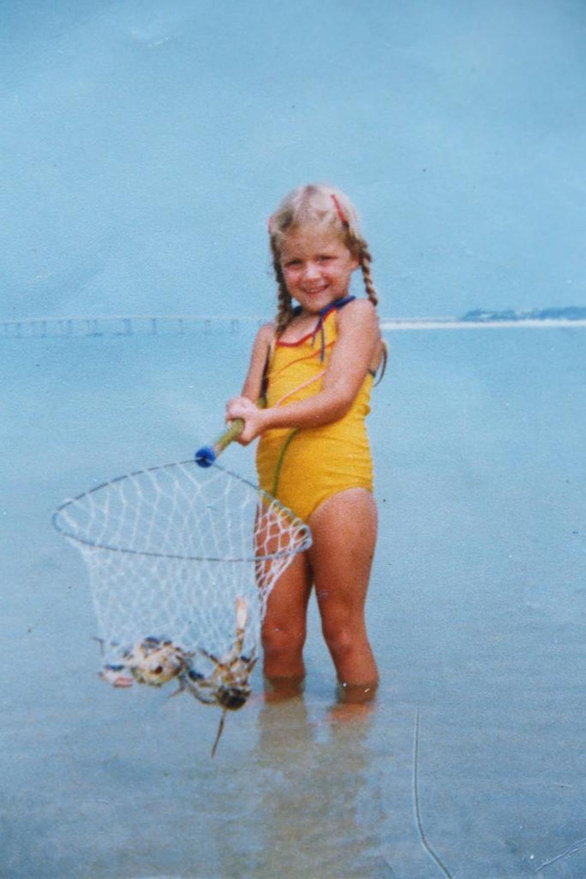 Chef Ashley Christensen on the beach during a family vacation during Christensen’s first time crabbing.