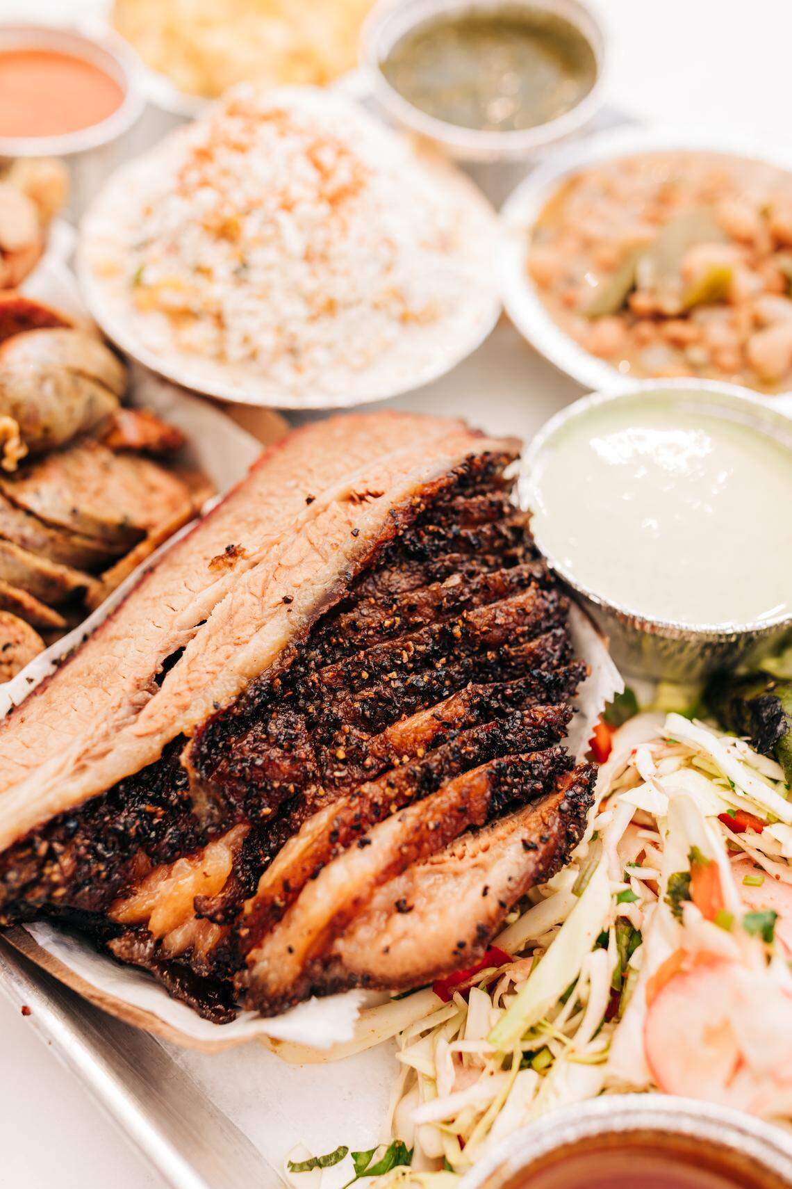 The restaurant East of Texas serves smoked meats including brisket, turkey and chicken, along with Tex-Mex-inspired sides such as chips and salsa, queso or guacamole, and Tajin street corn salad.