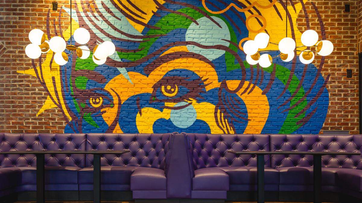 The new Smash Social Club is opening in November in the former Carolina Ale House space on Glenwood Avenue in Raleigh, N.C. It features murals by Durham-based artist Gabriel Eng-Goetz.