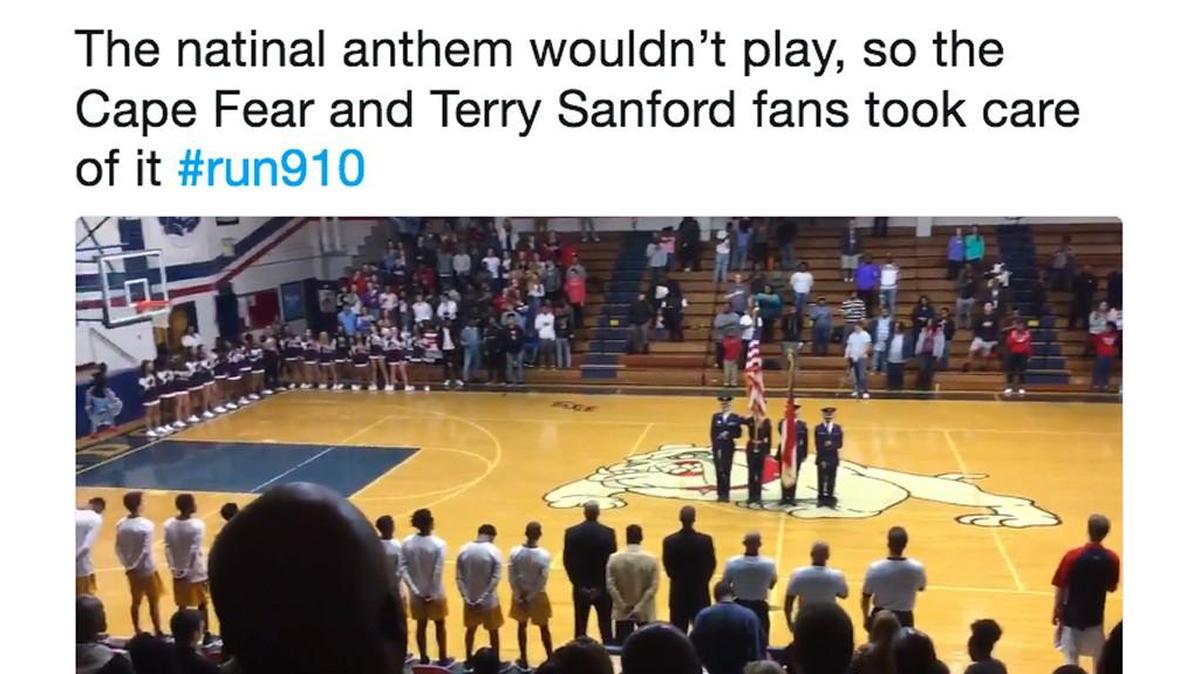 A screenshot of a tweet by Fayetteville Observer sports writer Patrick Obley capturing fans singing the national anthem after the PA system failed at the start of the high school basketball game between Cape Fear and Terry Sanford in Fayetteville NC Tuesday, Nov. 28, 2017.