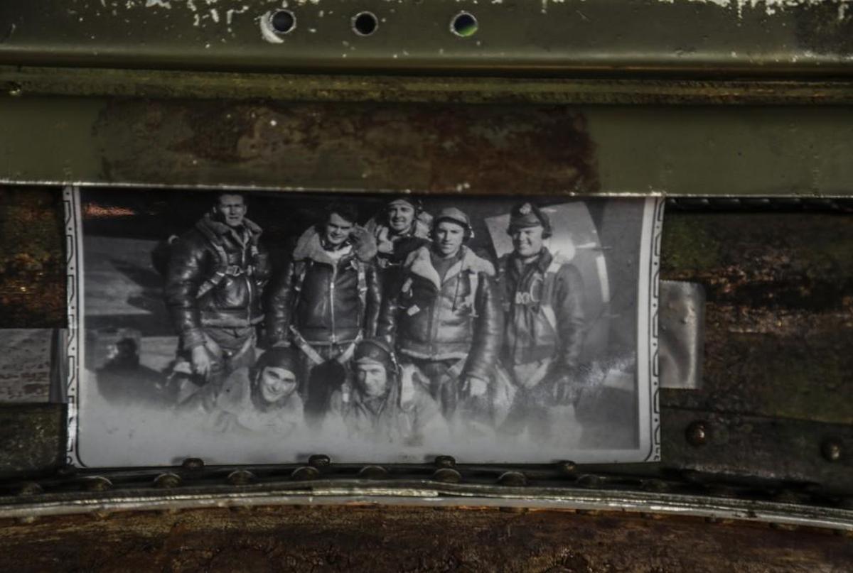 A photo of World War II era flight crew hangs in the fuselage of the Madras Maiden, a restored World War II-era B-17 Flying Fortress bomber, Thursday, Sept. 7, 2017 at Raleigh Executive Jetport in Sanford. The nonprofit Liberty Foundation will be offering rides and ground tours of the bomber to the public this weekend.