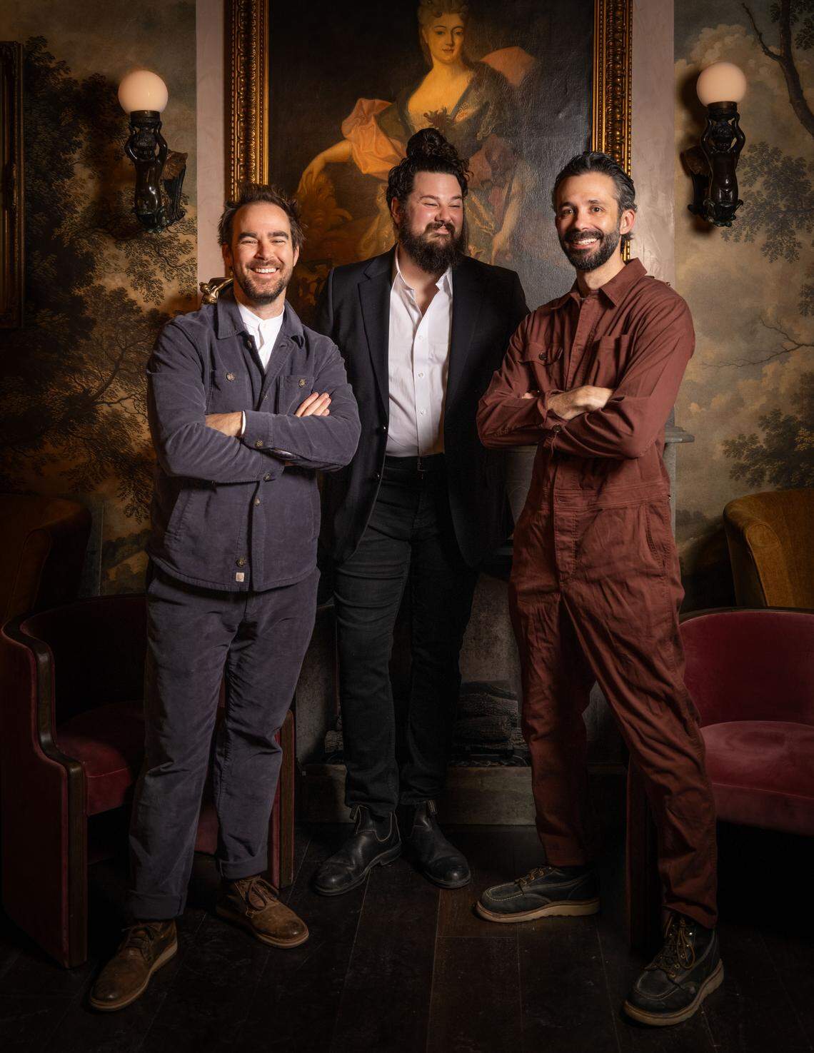 Capulet Cocktail Club co-owners Patrick Shanahan, left, and Robby Opperman, right, stand with beverage director Zack Thomas inside the new cocktail bar in Raleigh.