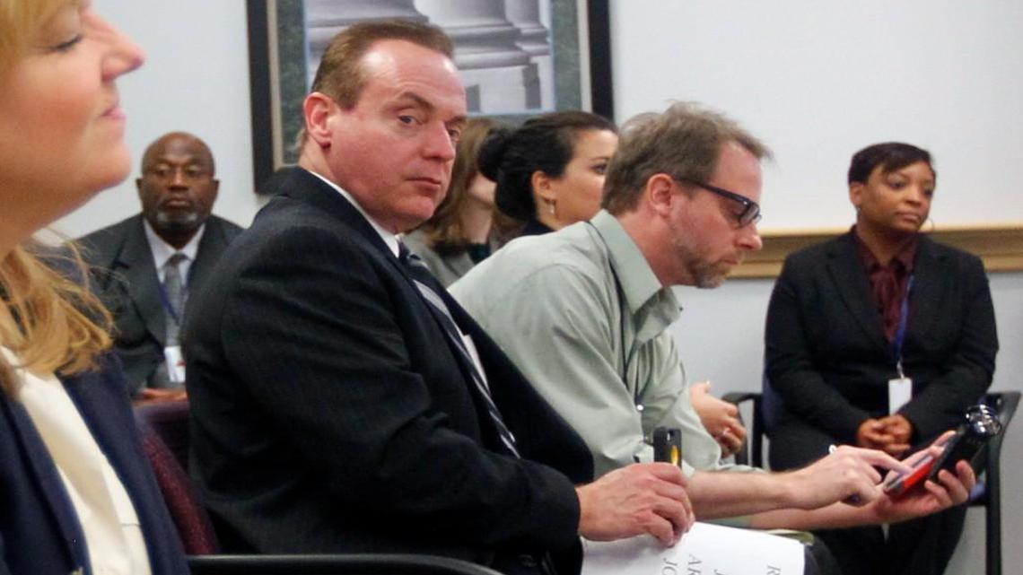 Wayne County Judge Arnold Ogden Jones, (second from left) attends a meeting of the NC Innocence Inquiry Commission Dec. 5, 2014 in Raleigh, NC. Jones, chairman of the commission, was charged in Federal Court Wednesday, Nov. 4, 2015 with trying to bribe an FBI agent with beer and cash to obtain copies of text messages involving members of his family.