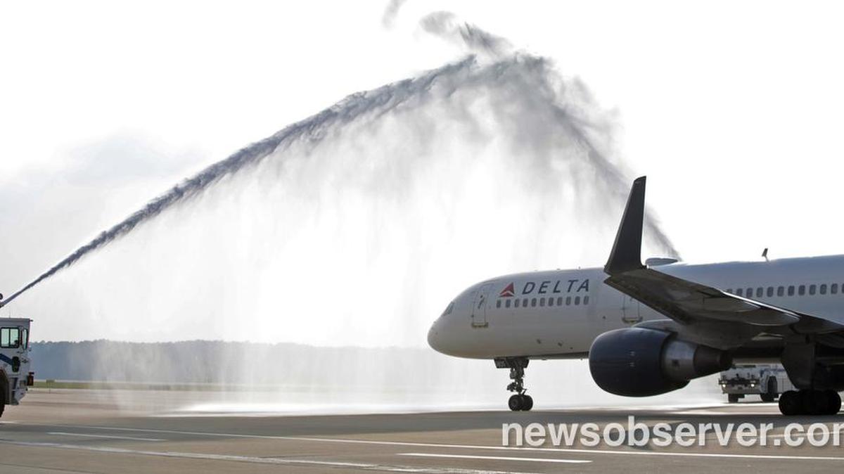 The inaugural Delta Flight 230 to Paris from Raleigh-Durham International Airport gets a water cannon salute from a pair of RDU's Crash/Fire/Rescue water cannons as they left the gate Thursday, May 12, 2016.