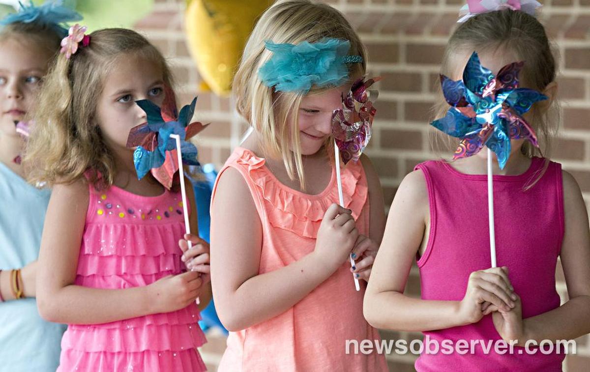 From left, Hollis Finch, 6, Kaitlyn Hill, 6, Grace Draminski, 7, and Bennett Kracht, 7, dance during The Quest Academy charter school’s end of year showcase Thursday, June 2, 2016 in Raleigh, N.C.